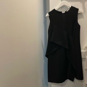 Little black dress with a “flare”: above the knee: good condition